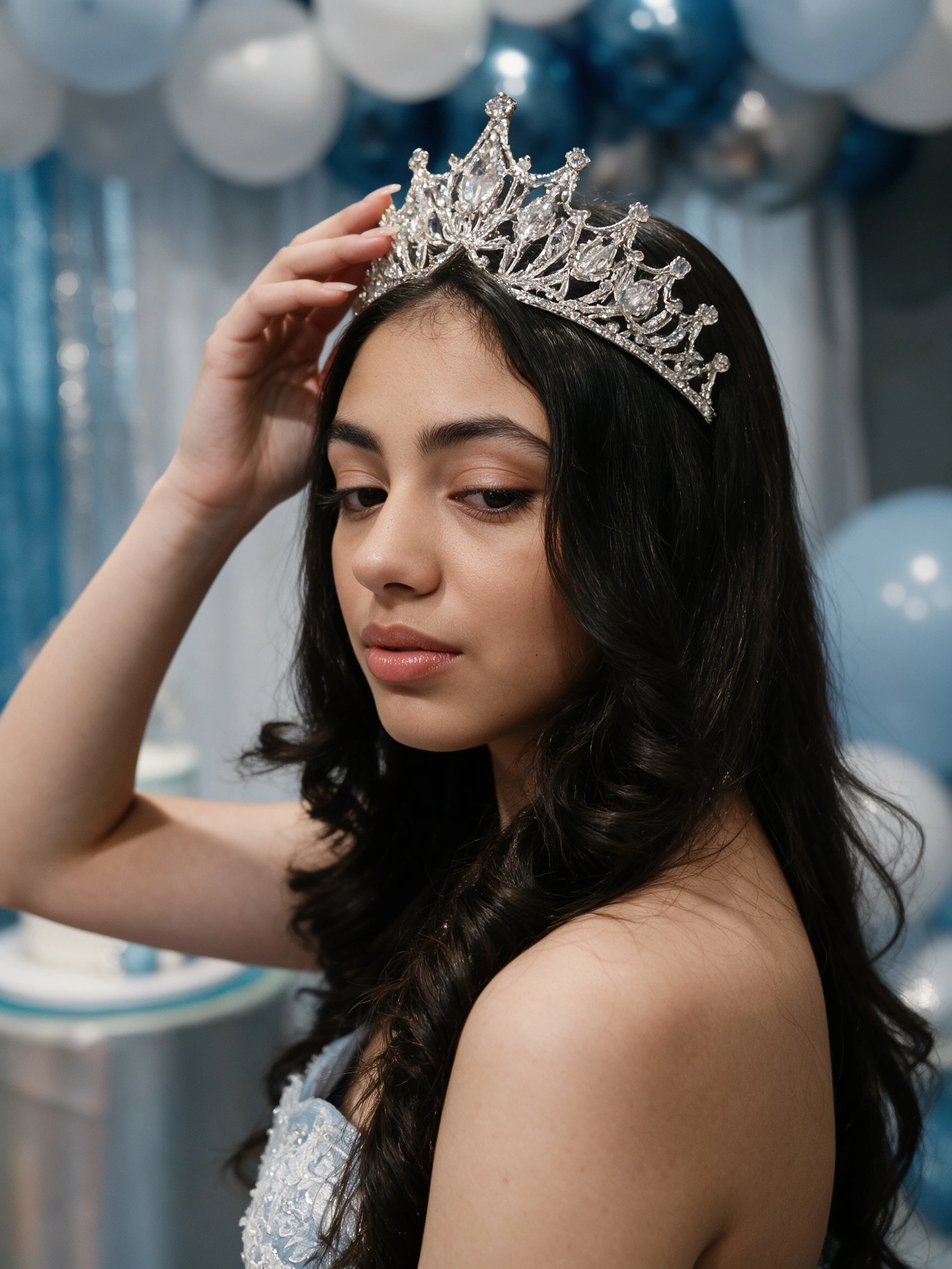 Crystal tiara styled with a sky blue Sweet 16 ball gown