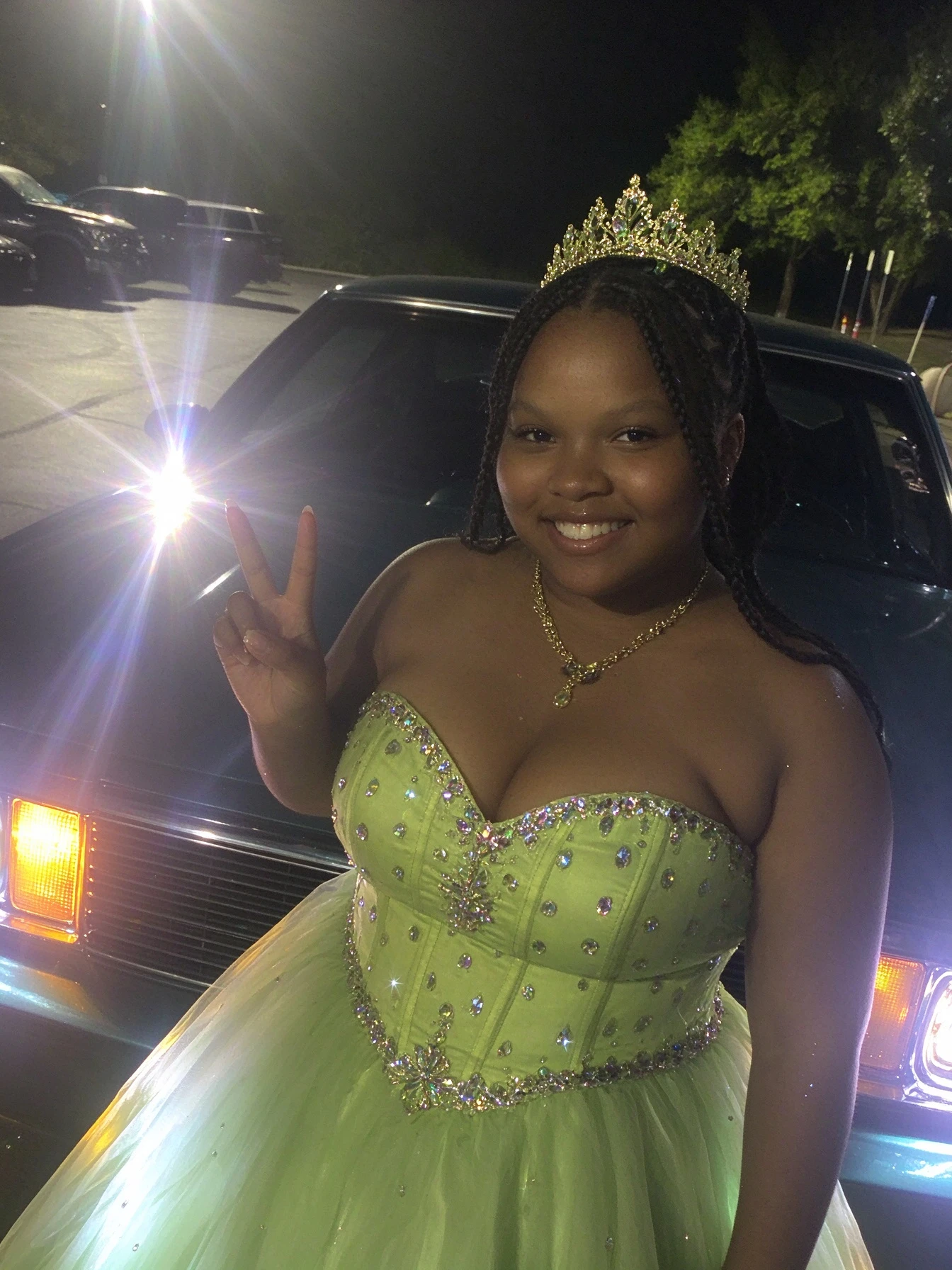 Close-up of the rhinestone corset and sweetheart neckline on a lime green formal ball gown