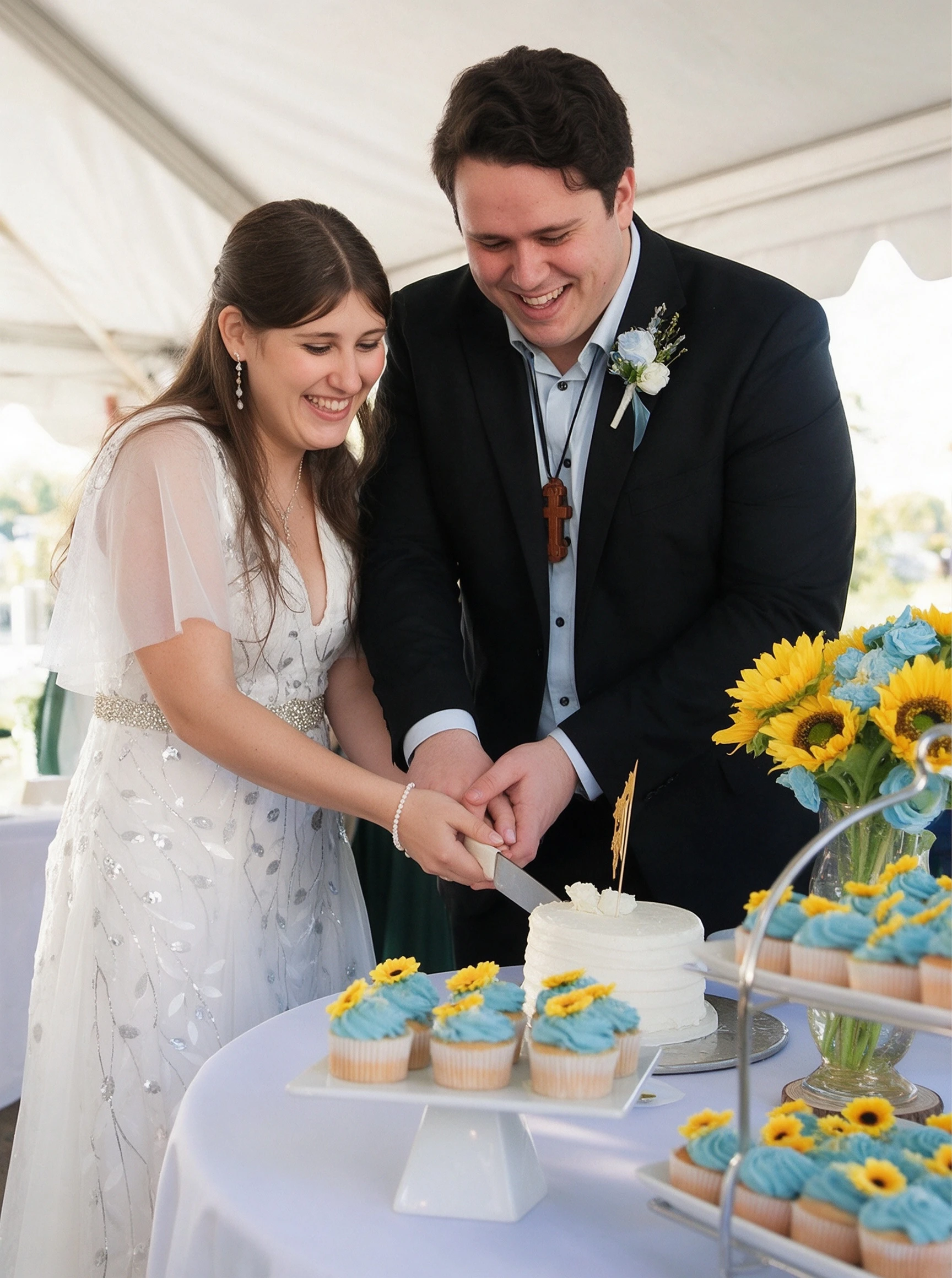 Lauren and Dan cutting their wedding cake in her silver embroidered ivory gown