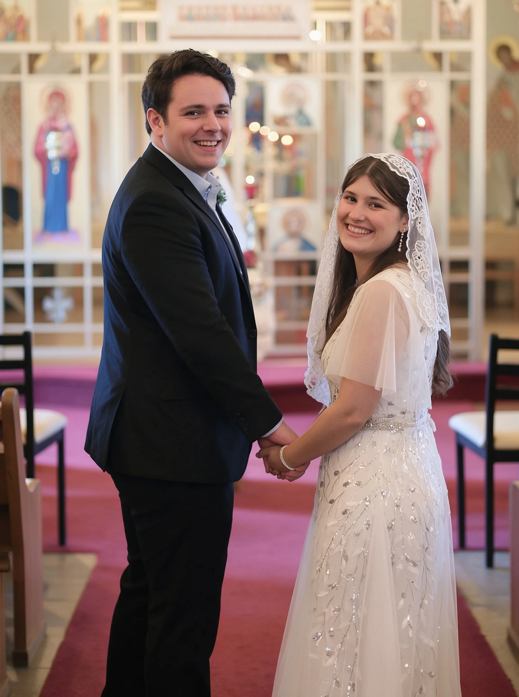 Lauren and Dan sharing a happy moment at the altar in their wedding ceremony