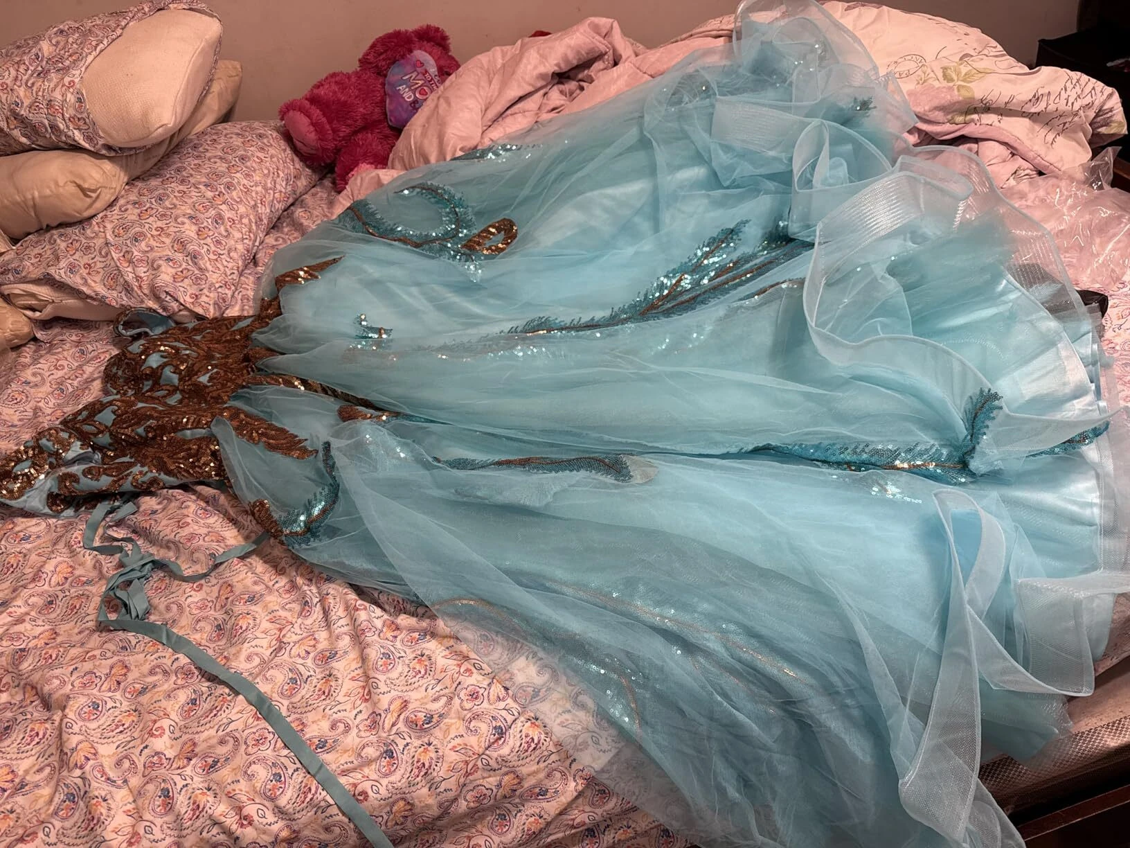 Close up of turquoise tulle fabric and layered skirt detail