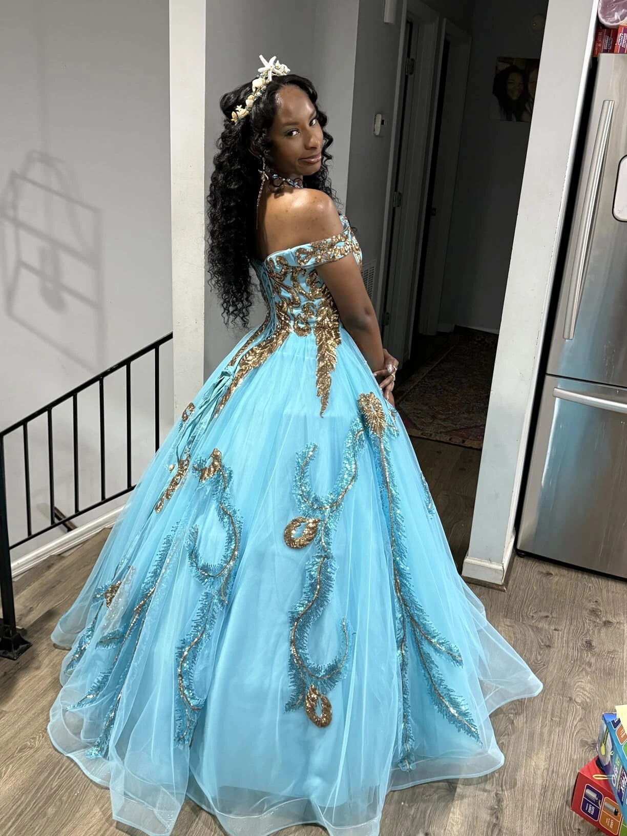 Back view showing the full turquoise tulle skirt of the prom gown