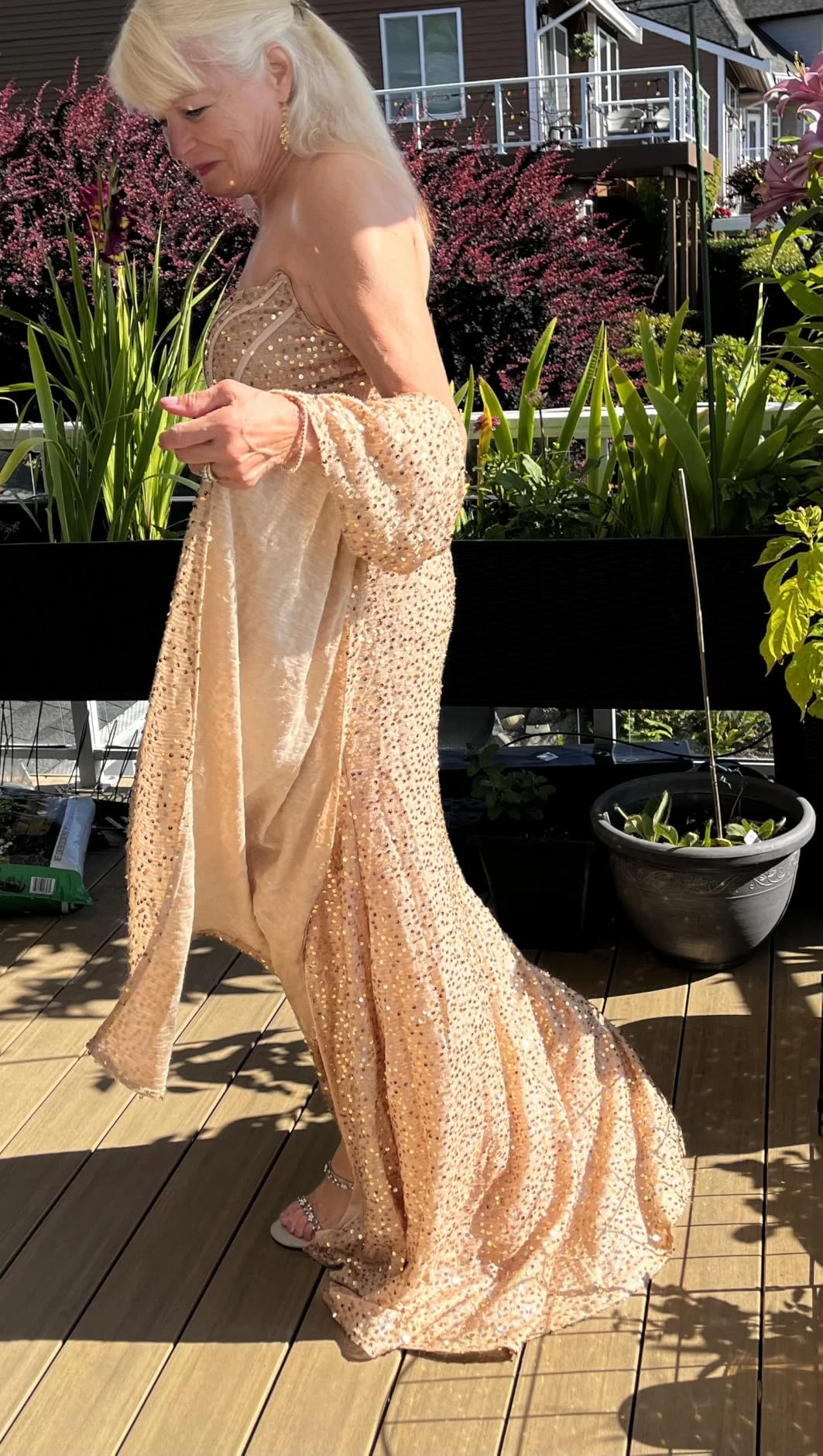 Gold sequin gown with flowing shawl