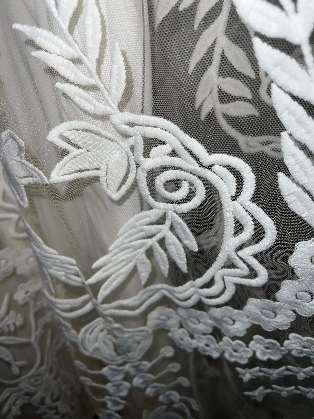 White leaf embroidered lace wedding dress closeup