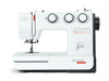 Bernette 35 white sewing machine with black accents, three dial controls, and accessory tote bag included