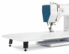 bernette 05 Academy sewing machine with white extension table and blue thread, side angle view
