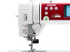 Close-up of the Janome MC6650 thread tension dial and threading path, showing the adjustable industrial-style tension control for precise stitch quality across all fabric types