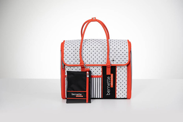 bernette b05 Academy sewing machine with polka dot tote bag featuring red trim and organized storage pockets