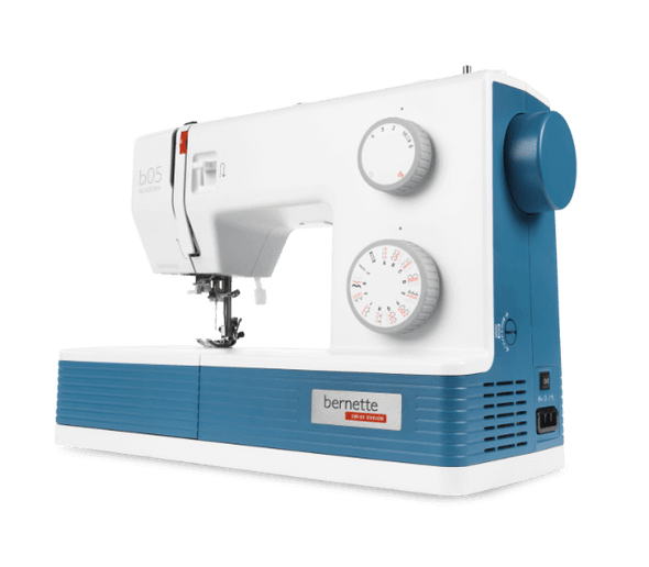 Bernette b05 Academy sewing machine in white and teal blue, side view showing dual dials and stitch settings