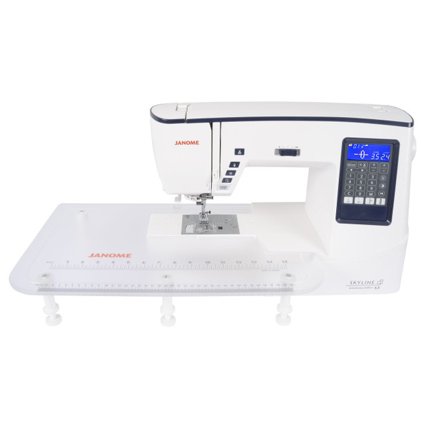 Janome Skyline S3 Anniversary Edition with extra-wide extension table attached, showing expanded quilting workspace