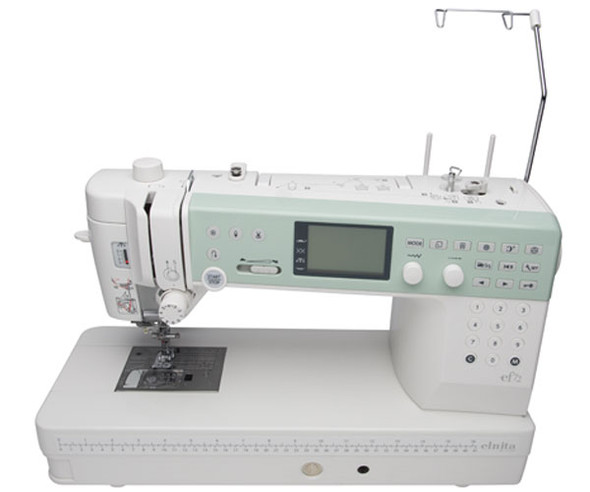 Elna EF72 shown from above with presser foot in up position, displaying the needle area, bobbin access, and workspace layout