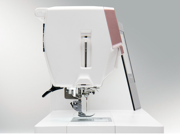 Janome MC9410 QC shown from the right side highlighting the Enhanced Superior Needle Threader and presser foot area