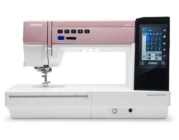 Janome MC9410 QC with extension table, accessory storage case, AcuFeed HP2 foot and needle plate, and AcuFeed standard and open toe feet bonus package