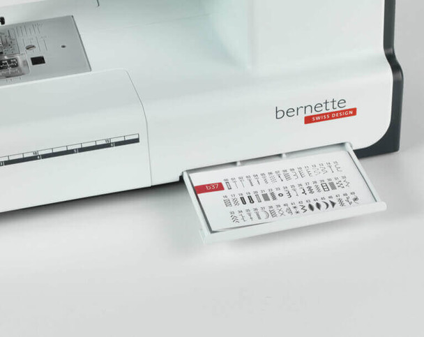 Bernette 37 computerized sewing machine in white with foot control and tote bag, front angled view