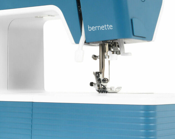 Bernette 05 Academy sewing machine in white and blue with presser foot detail and blue tote bag