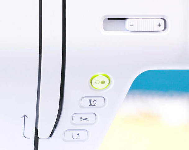 head of machine showing speed selector, thread cutter