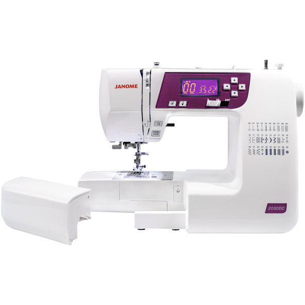 Janome 2030QDC-G sewing machine in use stitching smoothly on layered fabric for quilting or garment sewing.