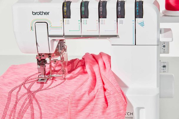 Brother CV3550 machine stitching pink athletic fabric showing double cover stitch capability