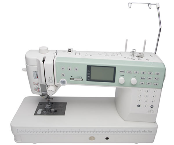 Elna EF72 shown from above with presser foot in up position, displaying the needle area, bobbin access, and workspace layout