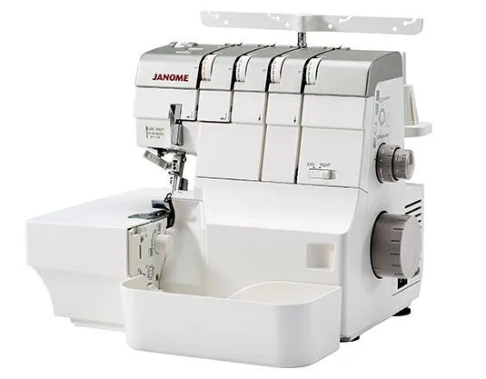 A clean product shot of the machine from a slight right-side angle with all panels closed. Shows the Janome branding, thread guides, stitch/tight dial on the right side, and the lower waste tray. White background.