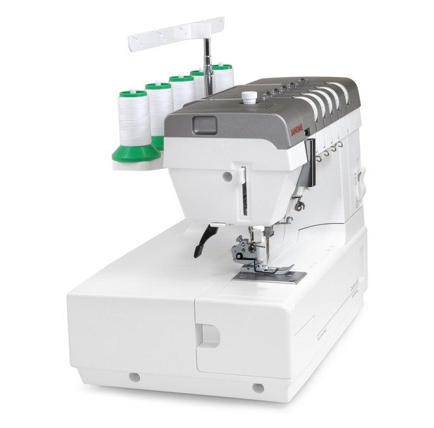 Left Angle with Spools: A three-quarter left-side view of the CoverPro 3000 with five white thread spools loaded on green spool caps. Shows the full machine profile, needle area, and the "CoverPro 3000 Professional" branding on the base. Clean white background. Good for a secondary product shot.