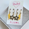 West Point Spirit Earring Stack with black mini enamel bolts and golden yellow starboys