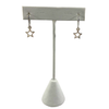 Silver open star huggie hoop earrings on display stand