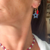 Wearing the Kansas Spirit Earring Stack for Jayhawks game day
