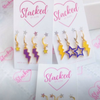 Northern Iowa Spirit Earring Stack in purple and golden yellow, Panthers huggie hoop earrings (view 5)