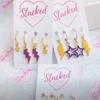 Washington Spirit Earring Stack in purple and golden yellow, Huskies huggie hoop earrings (view 5)