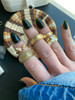 wearing social butterfly ring, croissant ring, honey marble ring, multi star ring