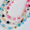 ys2k lucky charm necklaces in pink, black and blue