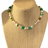 Green Lucky Charm Pearl Necklace on Stand Background Removed