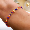 wearing one tailgate college game day bracelet in blue and orange for uva, syracuse, university of florida and auburn