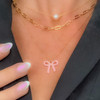 Pink enamel bow charm necklace on gold chain
