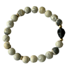 white howlite gemstone bracelet with black turquoise skull charm