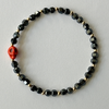 square hematite gemstones bracelet with orange turquoise skull beads