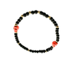 black onyx gemstone with two orange turquoise skull beads