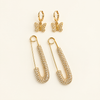 The Dolly Stack gold rhinestone safety pin earrings and glitzy butterfly huggie hoop earrings set