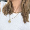 wearing lucky necklace