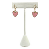 Statement Heart Huggie Hoop Earrings in  Pink Background Removed