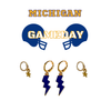 Michigan Classic Gameday Earring Stack with navy mini enamel bolts and gold baby stars
