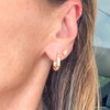 wearing rectangle gold hoops