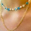 Wearing Eyes on Blue Necklace layered with simple chain link