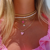 wearing pink enamel heart necklace