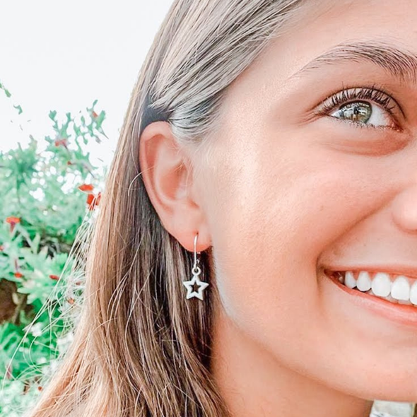 Wearing the New Mexico Spirit Earring Stack for Lobos game day