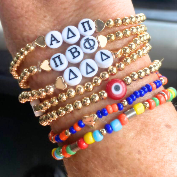 wearing set of 3 sorority bracelets alpha delta phi, phi beta pi, tri delta and college tailgate bracelets