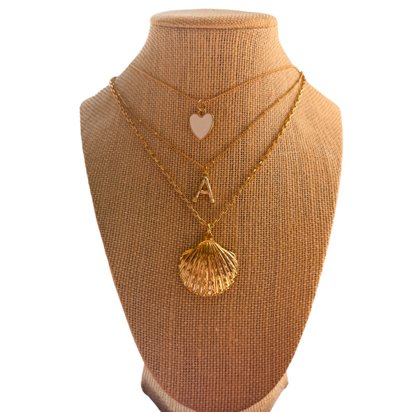 gold shell necklace on gold filled chain and gold initial necklace and statement heart white necklace gold shell necklace on gold filled chain and gold initial necklace and statement heart white necklace