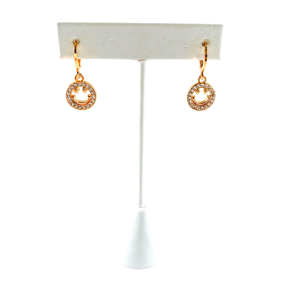 Glitzy Smile huggie hoop Earrings on Stand Background Removed