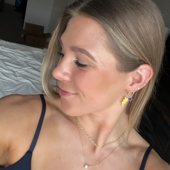 Wearing the Appalachian State Classic Gameday Earring Stack for Mountaineers game day